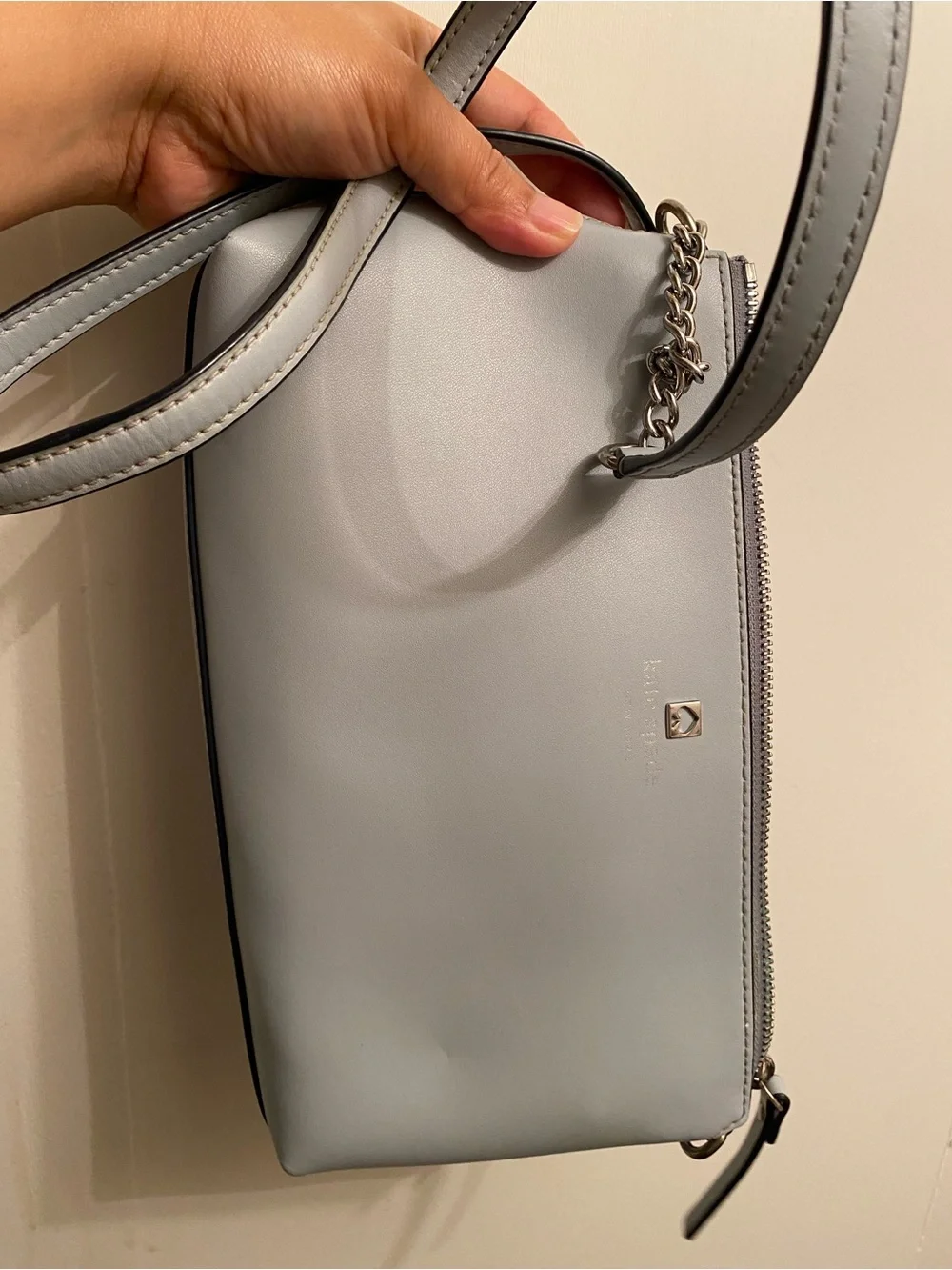 Kate Spade light gray leather crossbody bag with gold spade logo
